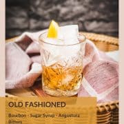 Gorgous glass filled with a delicious old fashioned drink. Placed on wooden coaster.