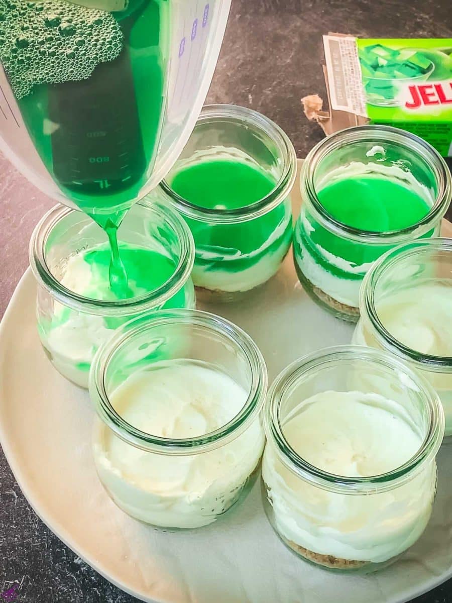 Pour the lime Jell-o on top of each cream cheese filled jar.