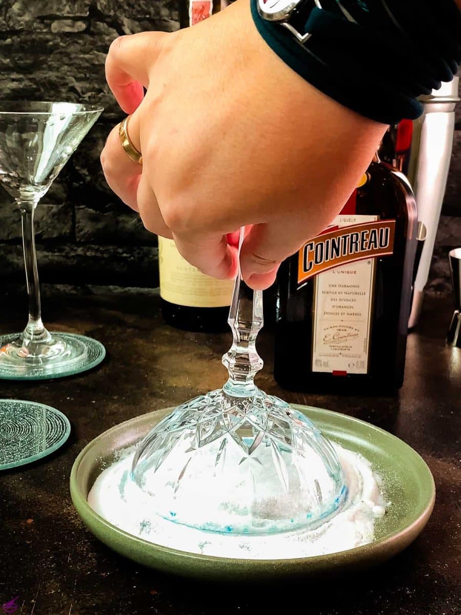 Turn the rim of your cocktail glass through the blue-colored fine sugar to make a beautiful sugar rim.