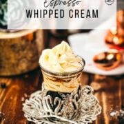 Delicious espresso whipped cream served on top of a coffee in a medieval styled glass cup.