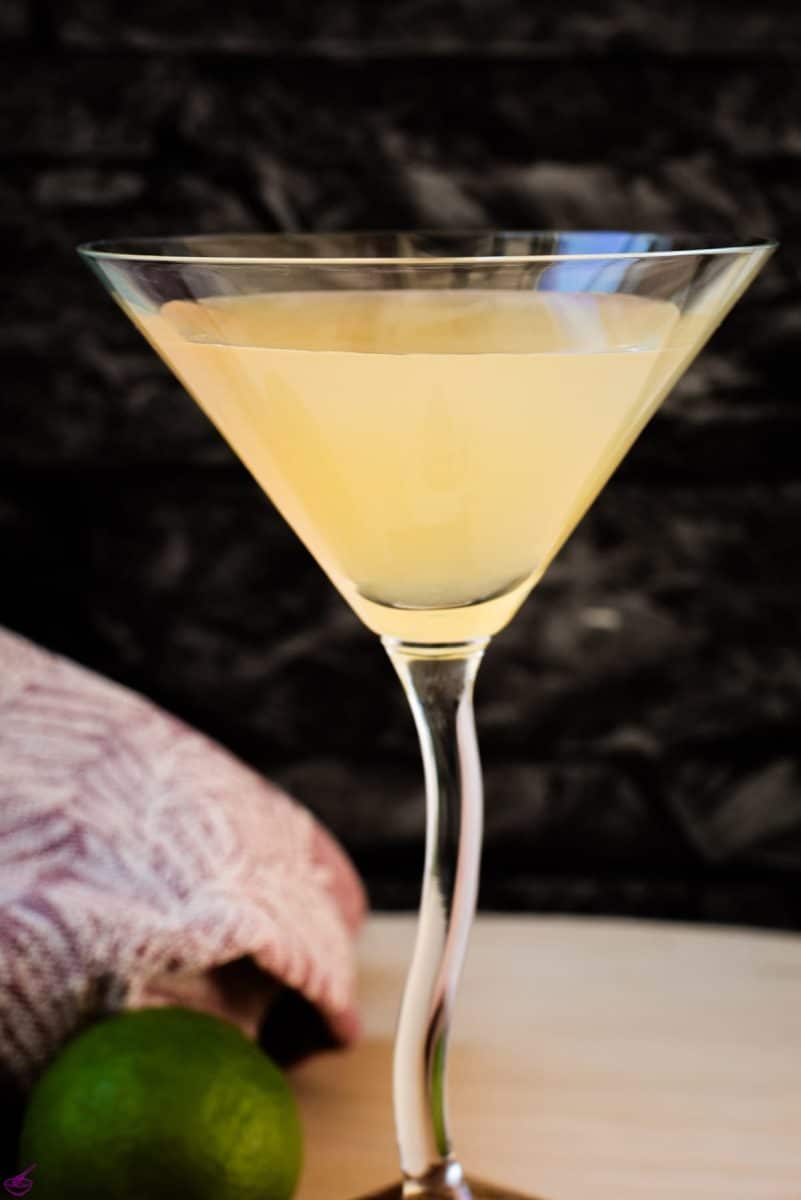 Gorgeous colored daiquiri in cocktail glass. Placed on a wooden board.