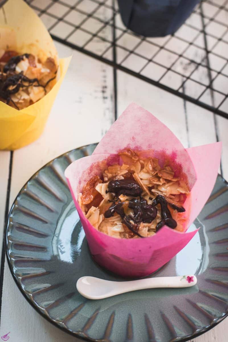 Delicious dried apricot breakfast muffins, with homemade caramel topping, sprinkled with melted chocolate after baking.