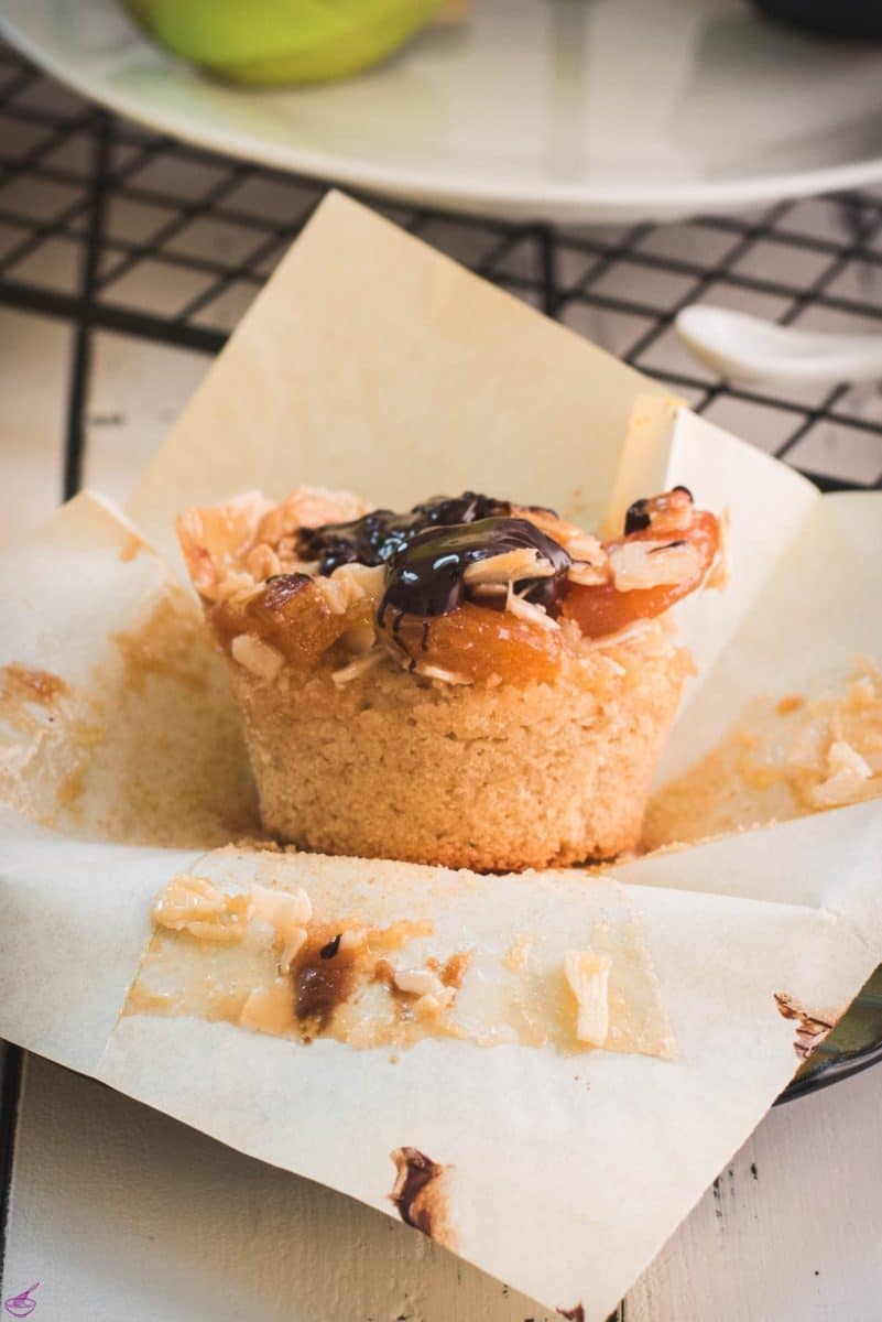 Delicious dried apricot breakfast muffins, with homemade caramel topping, sprinkled with melted chocolate after baking.