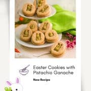 Gorgous cut out Easter cookies with pistachio ganache placed on cute tray.