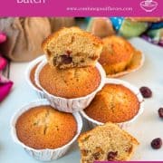 Delicious, and very easy to make, fruit cake muffins, filled with dried figs and dried cranberries. Placed on white plate.