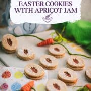 Gorgeous vegan Easter cut out cookies with apricot jam, placed on a white stone plate