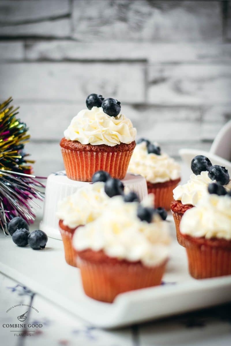 Gorgeous red, white and blue cupcakes, placed on white plate.