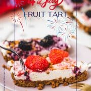 Delicious no-bake 4th of July fruit tart slices, placed on pink plate and two forks that wanna grab a bite.