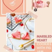 Gorgeous heart shaped sugar cookies with marbled icing, and filled with fig jam. Placed on gorgeous white golden serving plate.