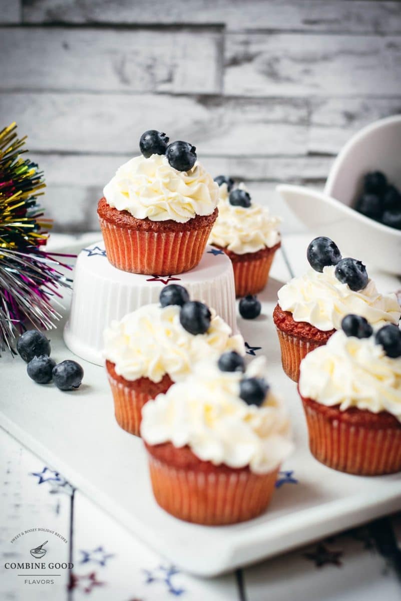 Gorgeous red, white and blue cupcakes, placed on white plate.