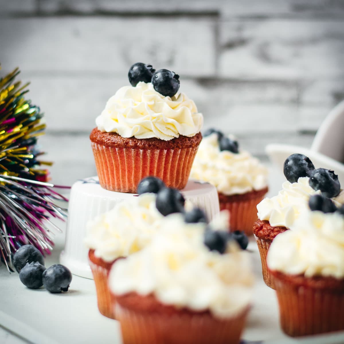 Gorgeous red, white and blue cupcakes, placed on white plate.