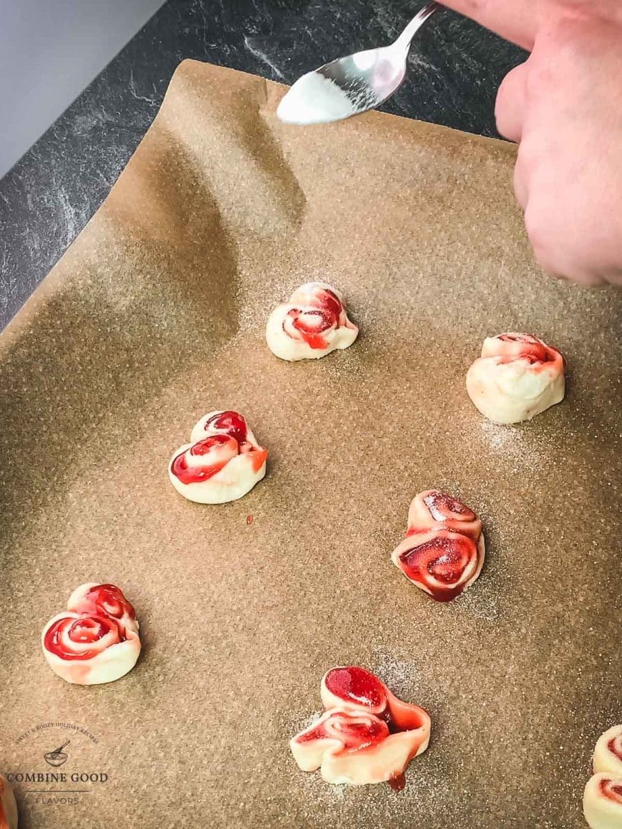 Sprinkle the heart shaped puff pastry slices with a vanilla sugar / granulated sugar mix.