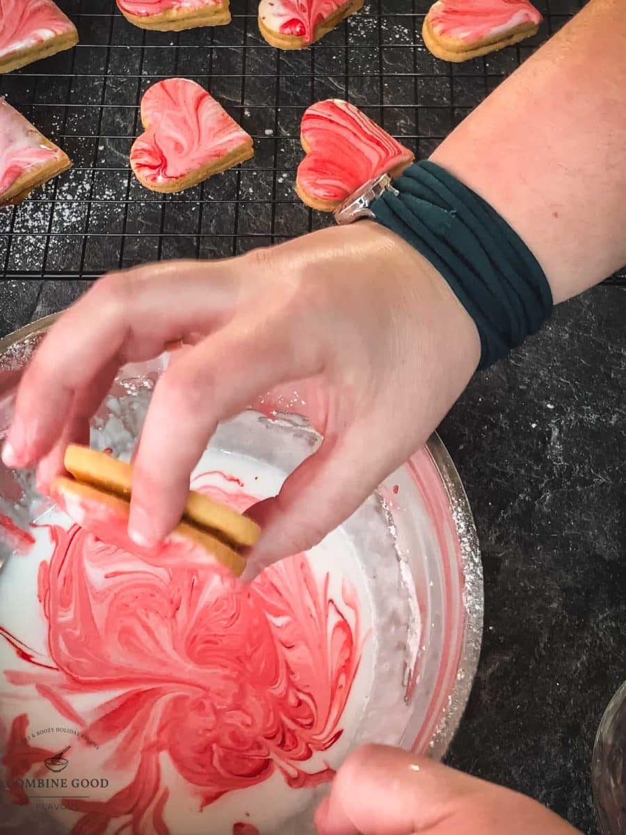 Gently shake off the marbled icing before placing the cookies on a cooling rack to let them dry.