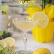 Gorgeous Limoncello Martini cocktail with elderflower syrup. Garnished with a lemon slice and placed on a mirrored coaster.