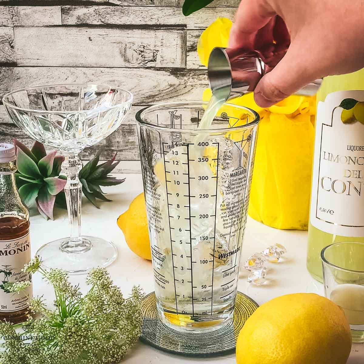 Adding Limoncello to the cocktail shaker.