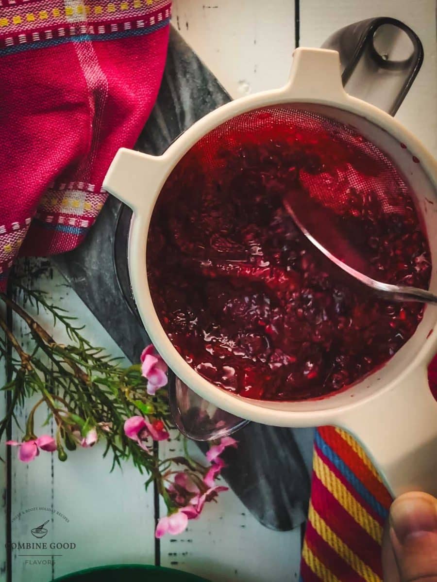 Pass the raspberry sauce through a fine-mesh sieve .