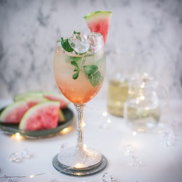 Gorgeous wine glass filled with watermelon spritzer.