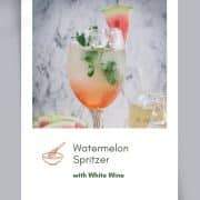 Gorgeous wine glass filled with watermelon spritzer, garnished with waterlemon slice and mint leaves.