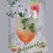 Gorgeous wine glass filled with watermelon spritzer, garnished with waterlemon slice and mint leaves.