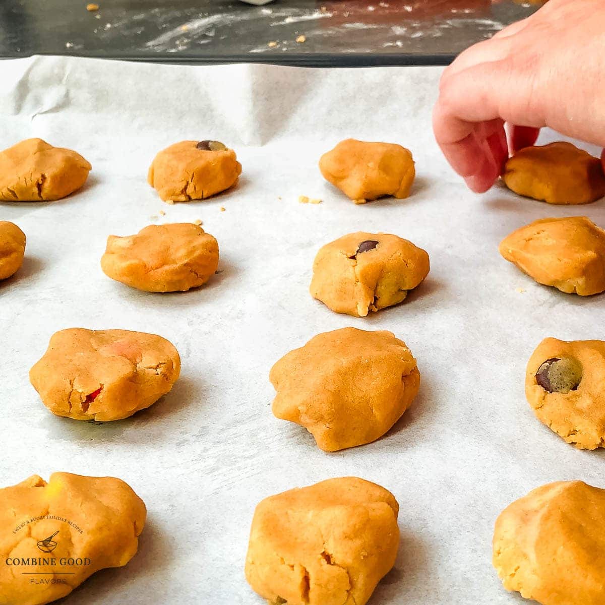 Place the peanut butter cookie dough ball on the baking sheet.