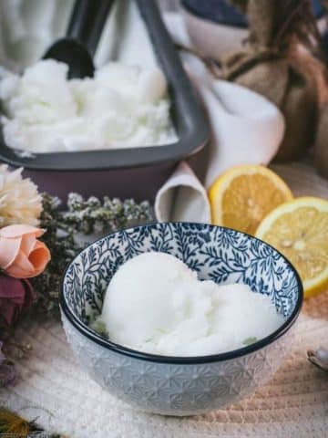 Delicious lemon sorbet served in white and blue patterned bowl.