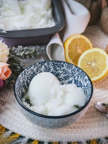 Delicious lemon sorbet served in white and blue patterned bowl.