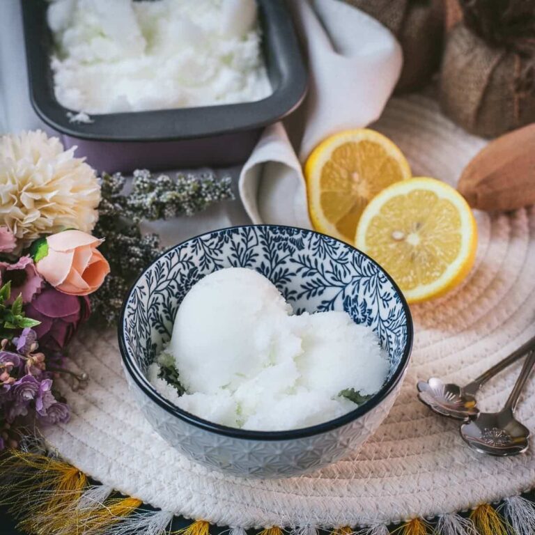 Delicious lemon sorbet served in white and blue patterned bowl.