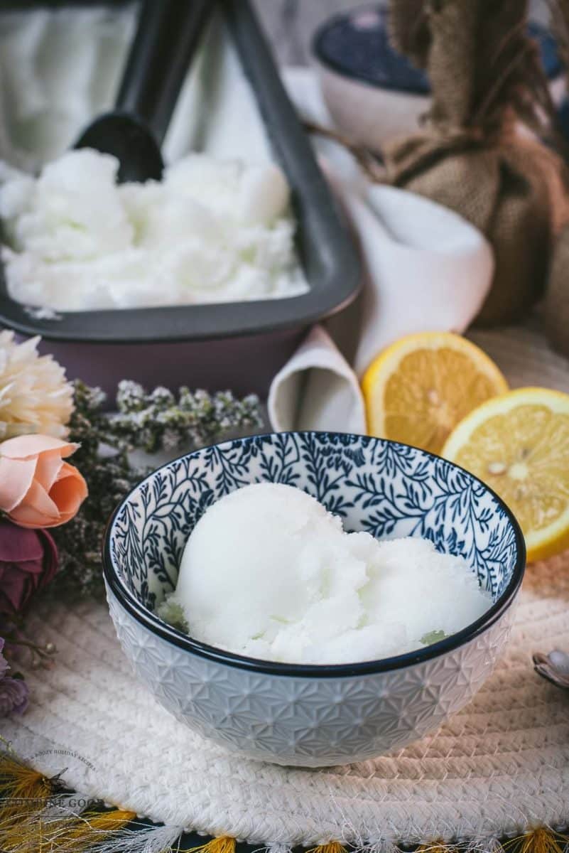 Delicious lemon sorbet served in white and blue patterned bowl.