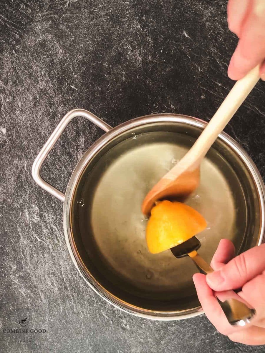 Remove the cooked lemons from the saucepan.