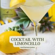 Gorgeous cocktail glass filled with a vibrant limoncello martini, garnished with a lemon wedge.