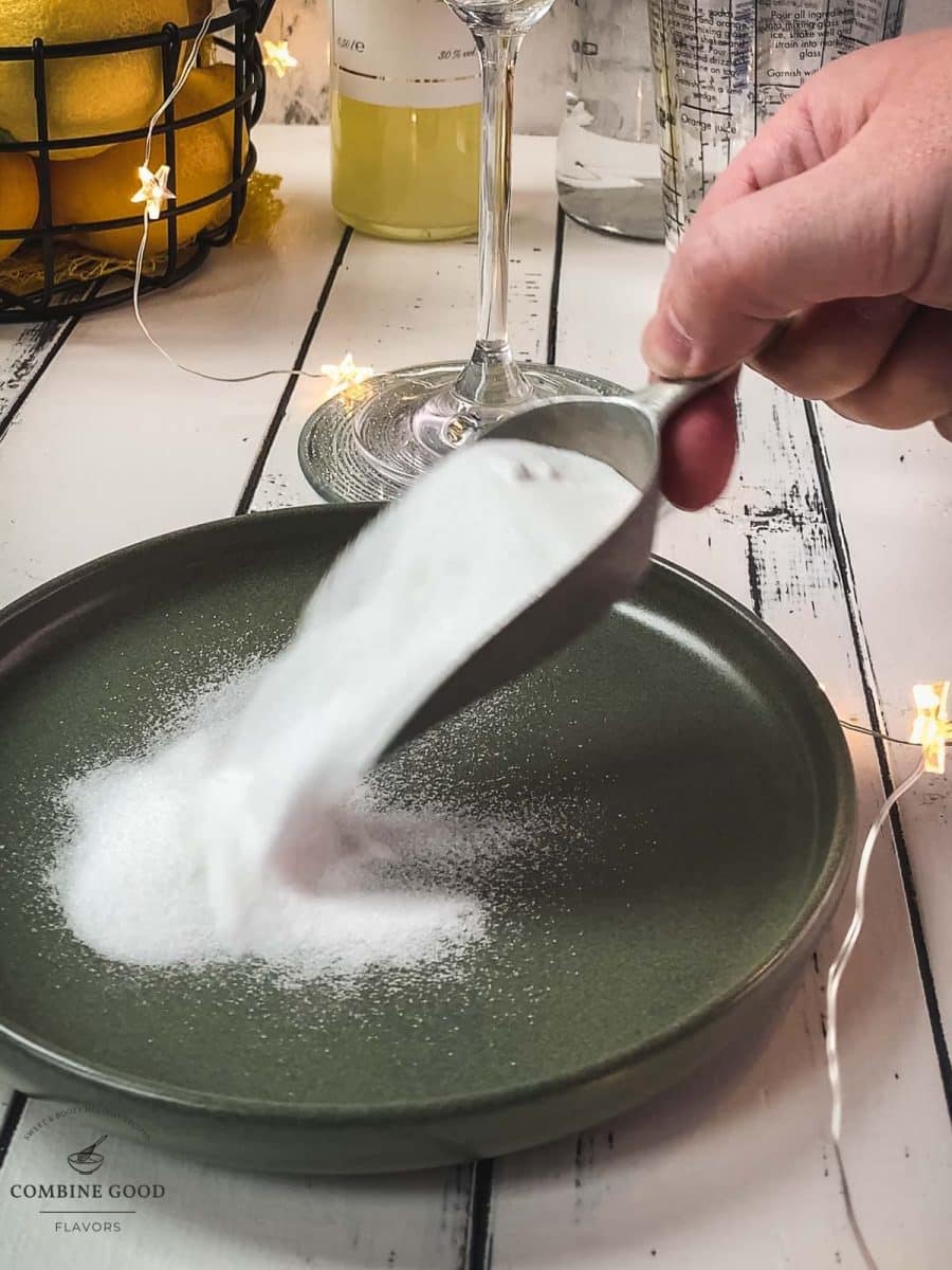 Adding the granulated sugar to a small green plate.