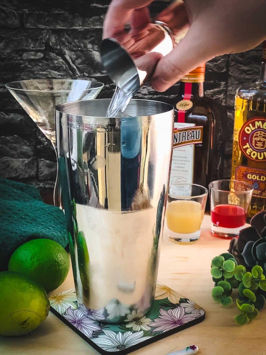 Add Cointreau to the cocktail shaker.