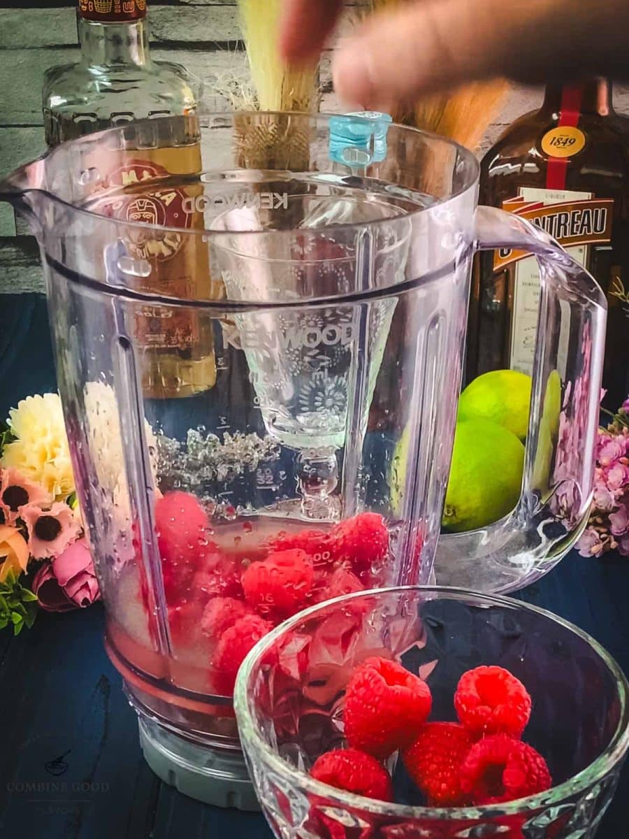 Add fresh raspberries to the blender.