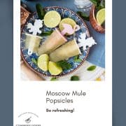 Gorgeous and refreshing Moscow mule popsicles placed on patterned plate.