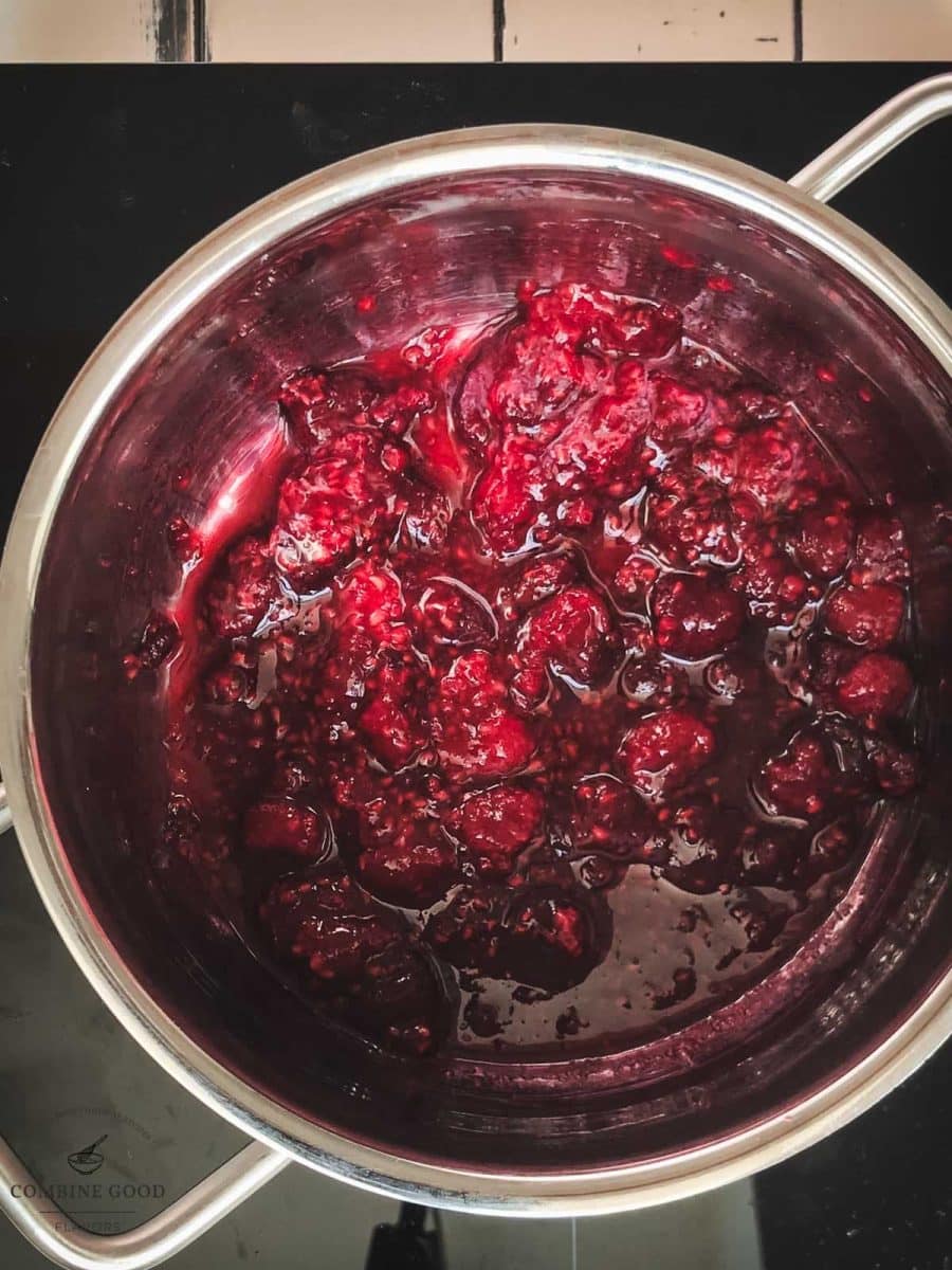 Raspberry sauce in a sauce pan.