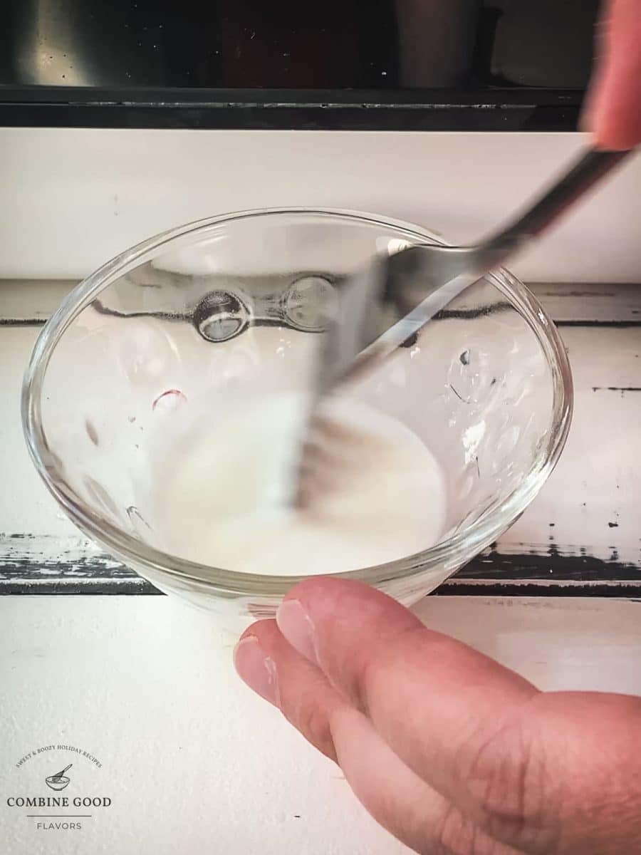 Mix cornstarch and water in a small bowl, creating a slurry.