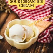 Delightful serving bowl filled with sour cream ice cream that looks like an ice cream cone with ice cream scoops. Placed on a brown wooden background.