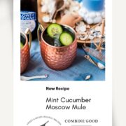 Refreshing mint cucumber Moscow mule served in copper mugs, placed on white and blue ground.