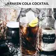 Gorgeous highball glass filled with delicious Kraken Cola. Served spookily next to a little spider on a spider web.