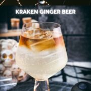 Gorgeous layered kraken ginger beer cocktail with spooky decoration.