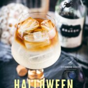 Gorgeous layered kraken ginger beer cocktail with spooky decoration.