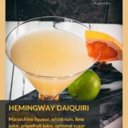 Vibrant Hemingway daiquiri, with a tart and slightly sweet flavor. Served in a gorgeous cocktail glass and placed on a marbled plate.