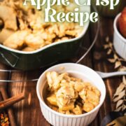 Serving bowl filled with freshly baked apple crisp topped with sour cream ice cream.