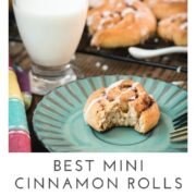 Yummy mini cinnamon rolls, drizzled with homemade sugar icing, placed on teal colored plate.