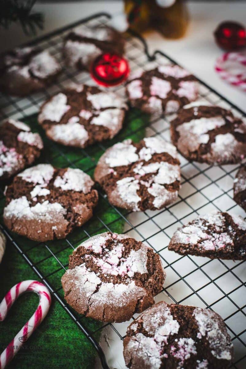 Gorgeous chocolate peppermint crinkle cookies placed on cooling rack.