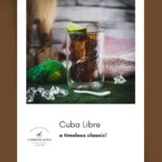 Twisted glass filled with a delicious Cuba Libre cocktail, placed on green felt mat.