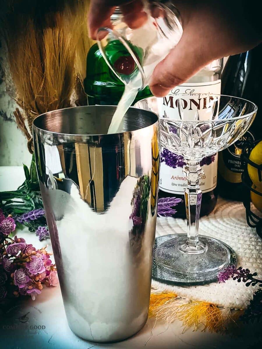 Add lemon juice to the cocktail shaker.