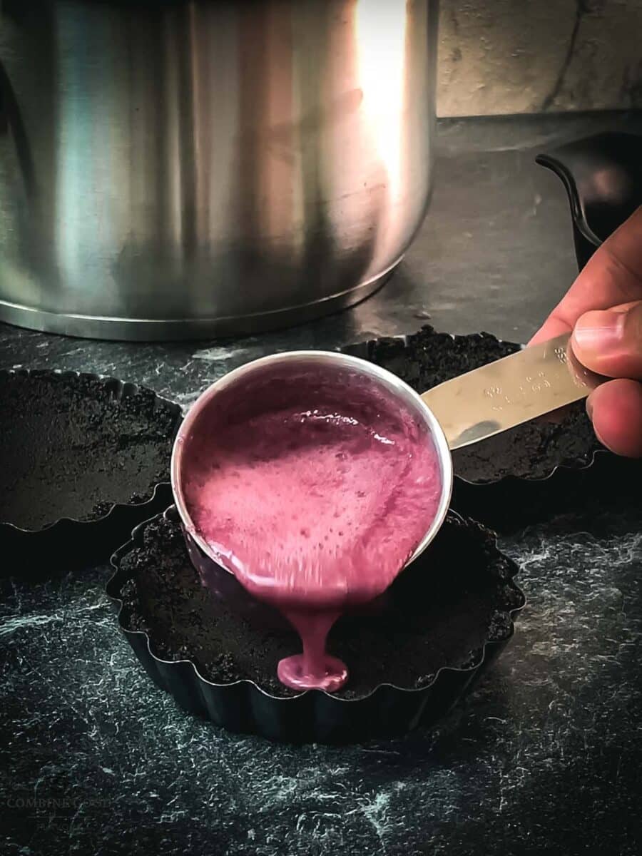 Carefully fill the berry mix ganache into the Oreo tarts.