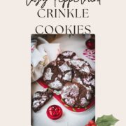 Gorgeous chocolate peppermint crinkle cookies placed on christmassy plate.