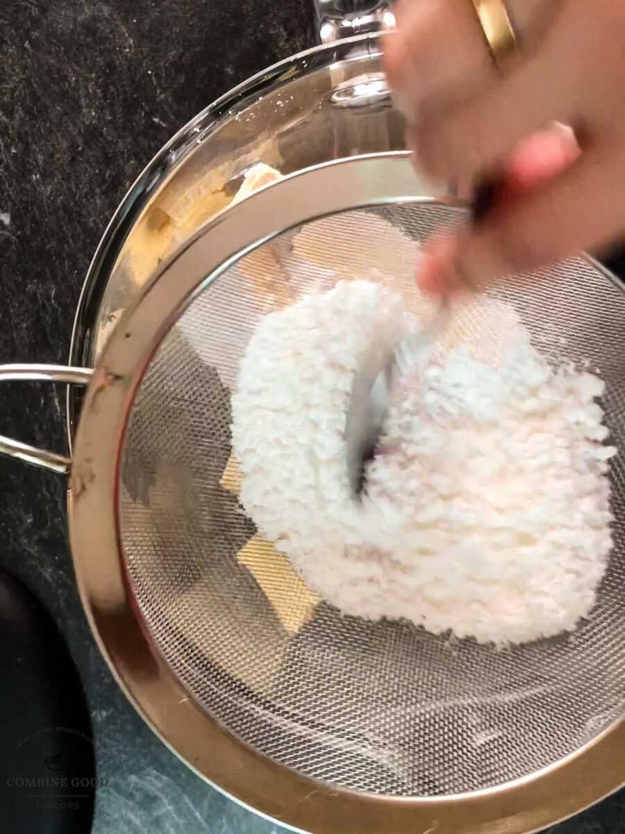 Sieve the powdered sugar into the mixing bowl.